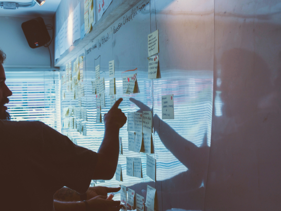 Person planning a website layout on a whiteboard